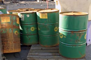 rusty green bp oil barrels