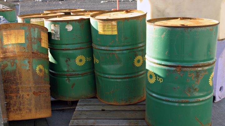 rusty green bp oil barrels